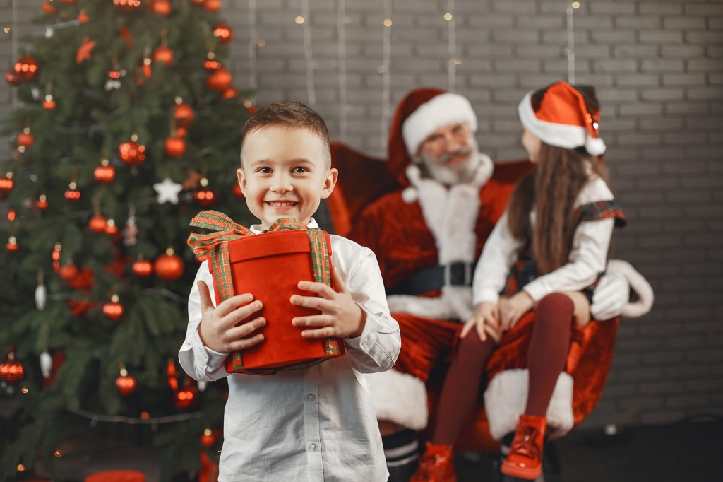 christmas-children-and-gifts-santa-claus-brought-gifts-to-children-joyful-kids-with-gifts-hugging-sant.jpg