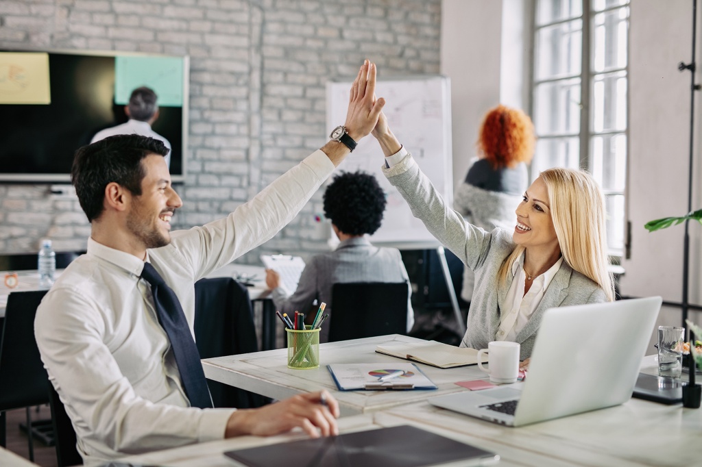 happy-business-people-supporting-each-other-giving-high-five-office.jpg