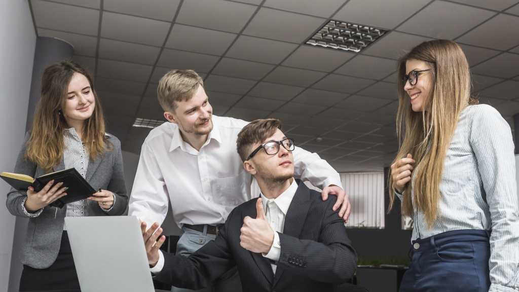 businessman-gesturing-thumbs-up-his-partners-workplace.jpg