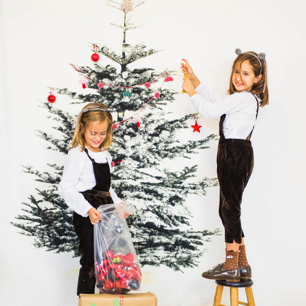 two-girls-decorating-christmas-tree.jpg